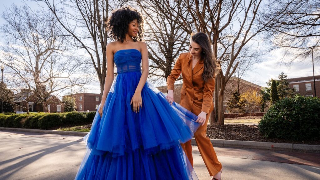 Cassidy Burel poses with model wearing one of her designs.