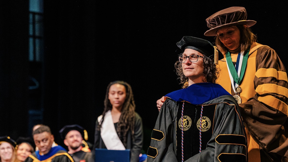 Kim Vogt during the hooding ceremony for her PhD from UNCG School of Nursing.