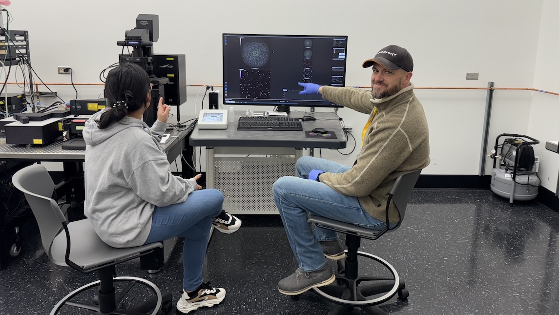 JSNN research assistant Kyle Nowlin working in the lab with students.