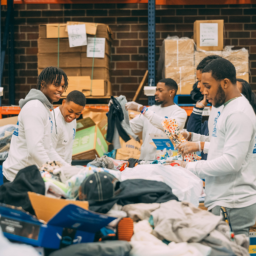 UNCG students sort clothes.