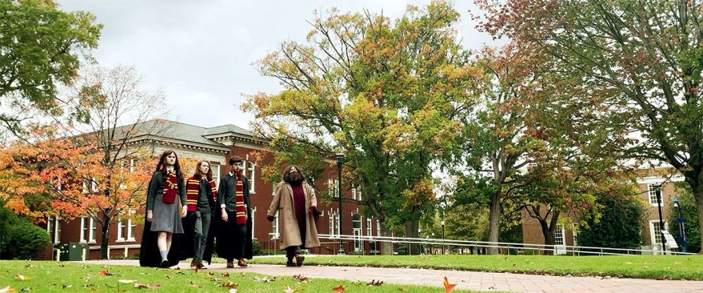 Actors in "Harry Potter and the Stone" film walk across UNCG campus.