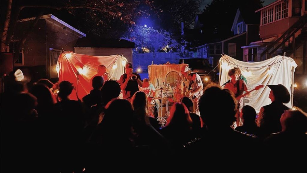 Guests dance to an outdoor band performing at Doggie House.