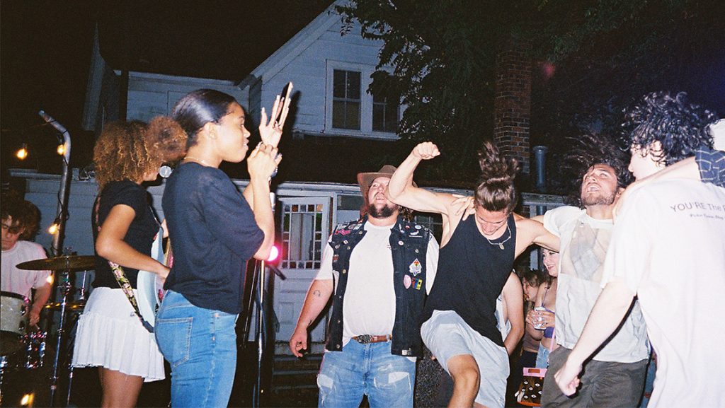 Guests dance to an outdoor band performing at Doggie House.