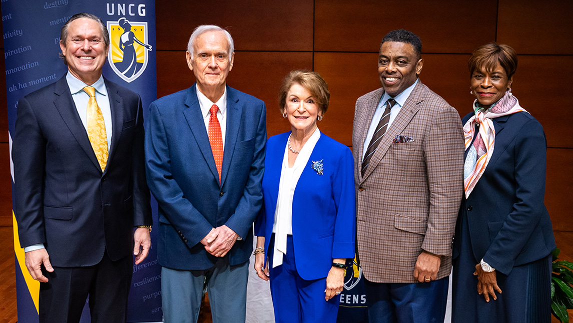 George Hoyle, Ed Kitchen, Linda Arnold Carlisle, Chancellor Franklin D. Gilliam, Jr., and Mae A. Douglas pose for a group picture.